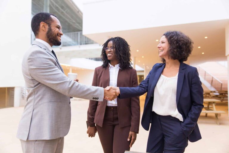 happy-positive-business-partners-finishing-meeting